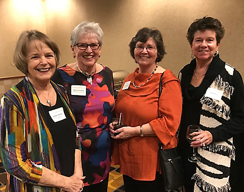 A group of four women posing for a picture at an Osher event.