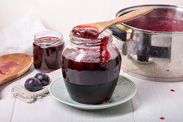 Cooking homemade plum jam