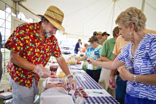 Retired MU Extension horticulturist Steven Kirk serves up his salsa at a previous MU Tomato Festival.