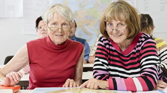 two women learning in a class